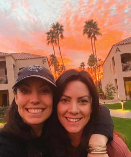 Mary Heffernan of Five Marys Farms and Ann Williams of Yearly Co at the Arizona Phoenician Resort & Spa in front of an incredible orange and pink sunset.